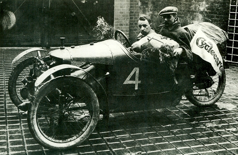 W. G. McMinnie and passenger F. Thomas pose in their 1913 GP for Cyclecars winning Morgan