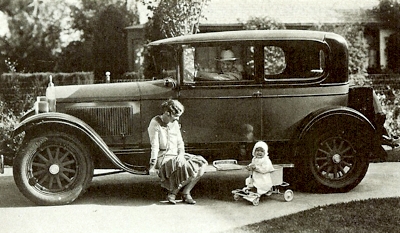 Stan Laurel of Laurel and Hardy fame, posing with his Hupmobile, wife and daughter
