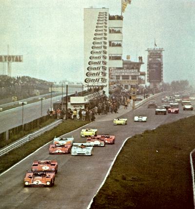 Cars passing the pits and control tower complex at the start of the 1972 Nurburgring 1000km